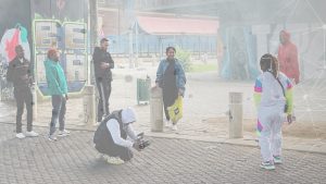 In picture: the music video shooting session of Indigo Stella in Newtown, Johannesburg. Image by Asko Mononen, background vector image by kjparteger/Freepik